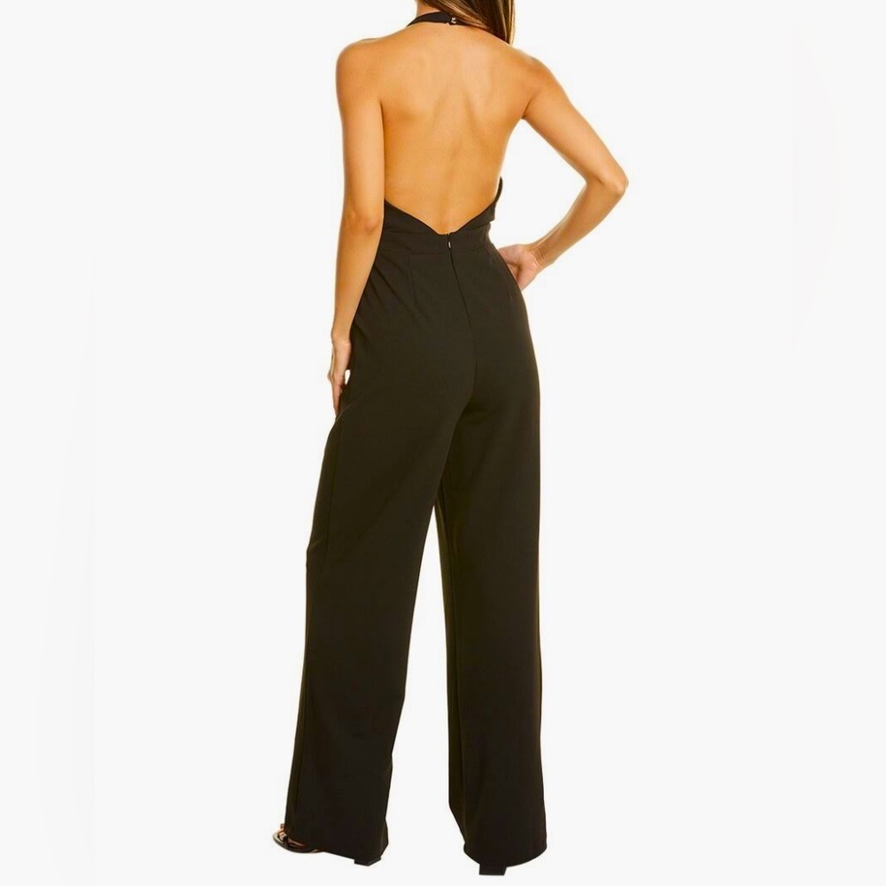 NWOT Black Halter Jumpsuit. Ties at the nape of the neck, slightly flared leg.